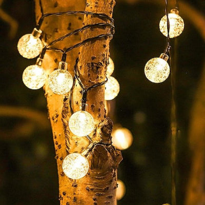 Guirlande lumineuse exterieur mini boule enroulee arbre
